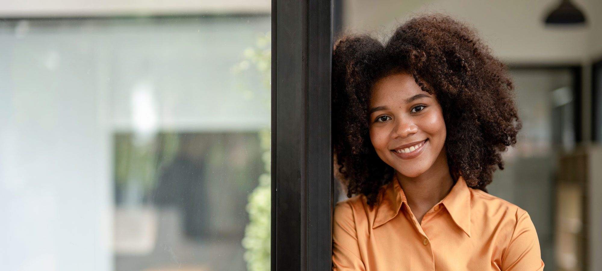 Portrait Of Confident Female Professional Standing With Arms Cro