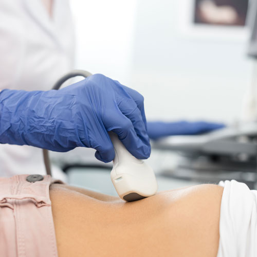 Cropped View Of Doctor Examining Stomach Of Patient With Ultraso Cropped View Of Doctor Examining Stomach Of Patient With Ultraso